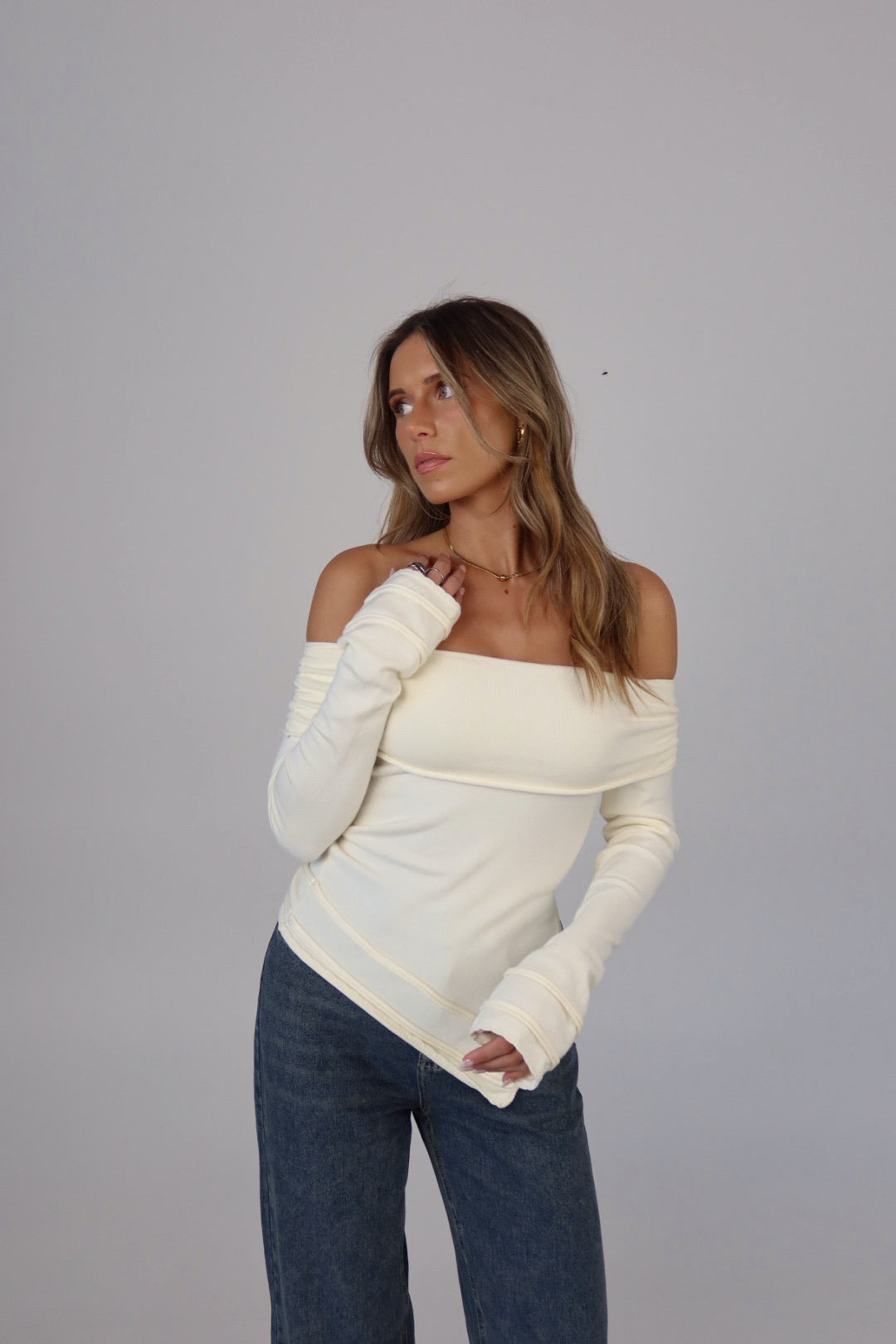 Annabelle Asymmetric Off-Shoulder Sweater in Ecru