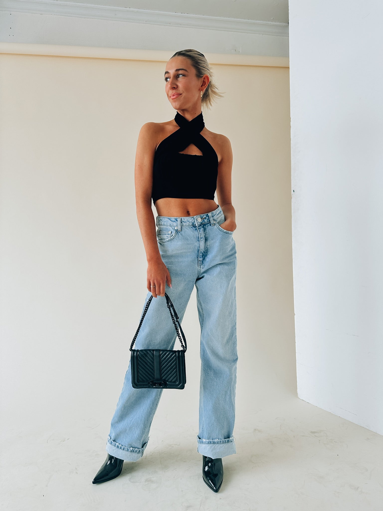 Kashmira Crossed Halter Crop In Black