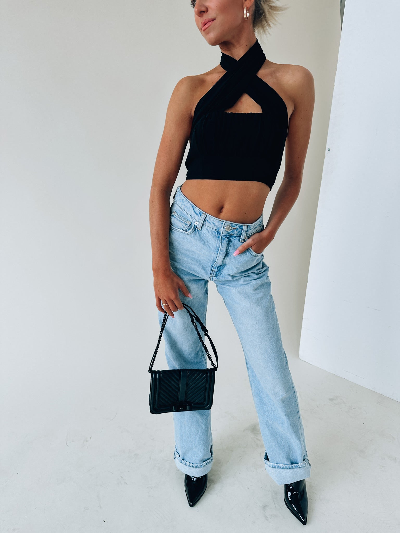 Kashmira Crossed Halter Crop In Black